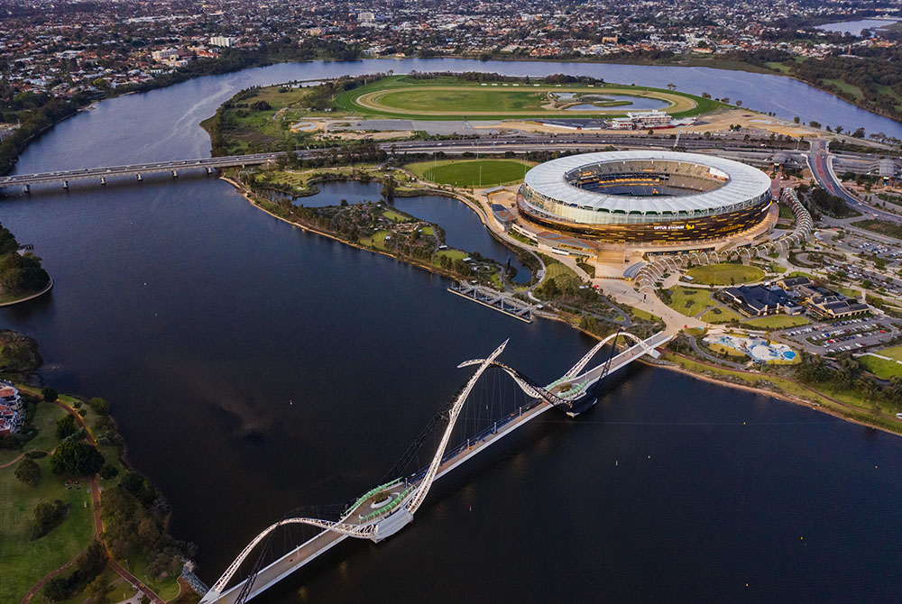 Aerial view of Perth Stadium, Burswood Jetty and Matagarup Bridge.